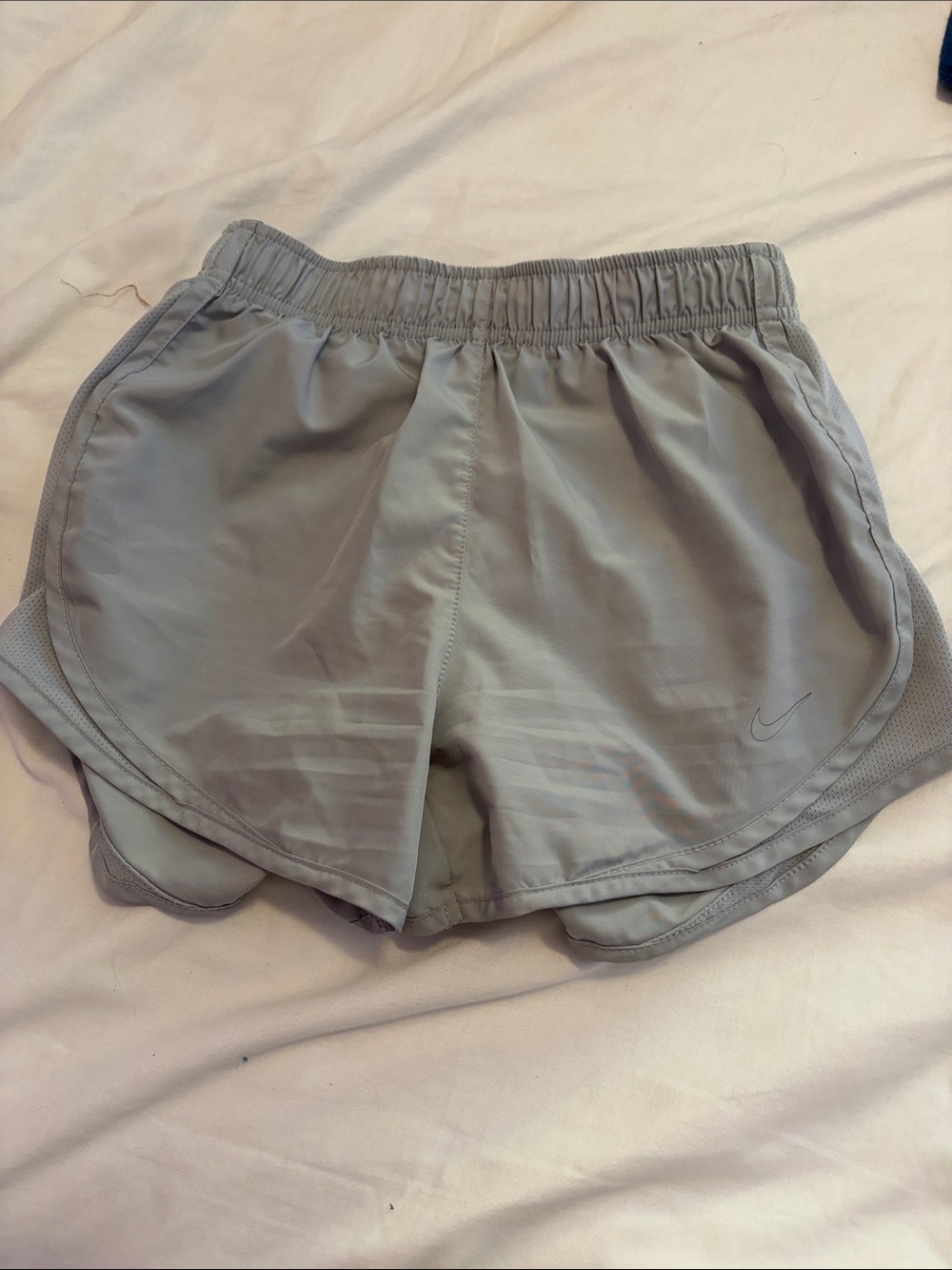 Nike Women's Light Gray Athletic Shorts with Subtle Swoosh